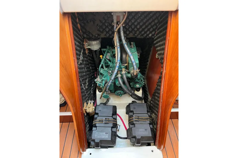 Slide: The Image of Engine compartment of a 2005 Beneteau First 36.7 sailboat, featuring a well-maintained engine. - 31