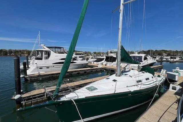 Slide: The Image of Sailboat Beneteau First 36.7, 2005 model, docked at marina with other boats. - 5