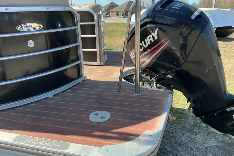Slide: The Image of 2015 Berkshire 230E STS pontoon boat with Mercury outboard motor. - 13