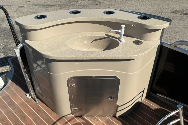 Slide: The Image of Berkshire 230E STS 2015 boat sink with countertop and storage on deck. - 8