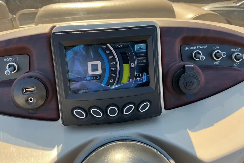 Slide: The Image of Dashboard of a 2015 Berkshire 230E STS boat with digital display and controls. - 9