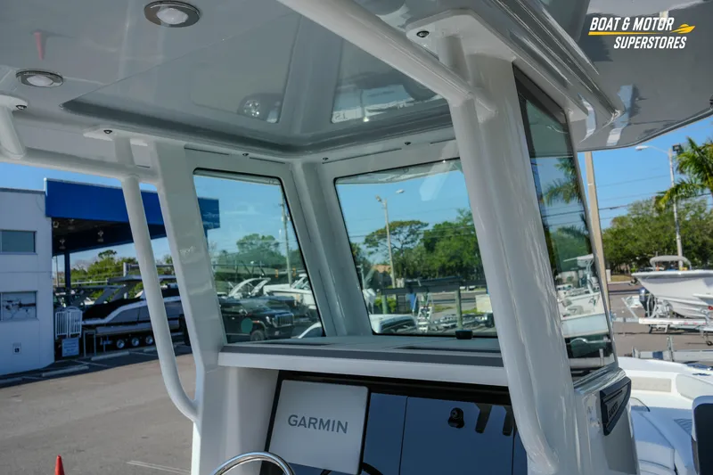 Slide: The Image of 2026 Blackfin 242 HB boat interior with Garmin navigation system at dealership. - 14
