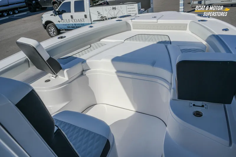 Slide: The Image of 2026 Blackfin 242 HB boat interior with cushioned seating and sleek design. - 16