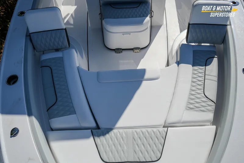 Slide: The Image of 2026 Blackfin 242 HB boat interior with cushioned seating and storage compartments. - 17