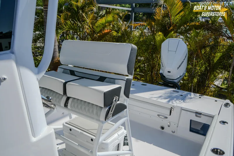Slide: The Image of 2026 Blackfin 242 HB boat interior with seating and Mercury engine. - 23