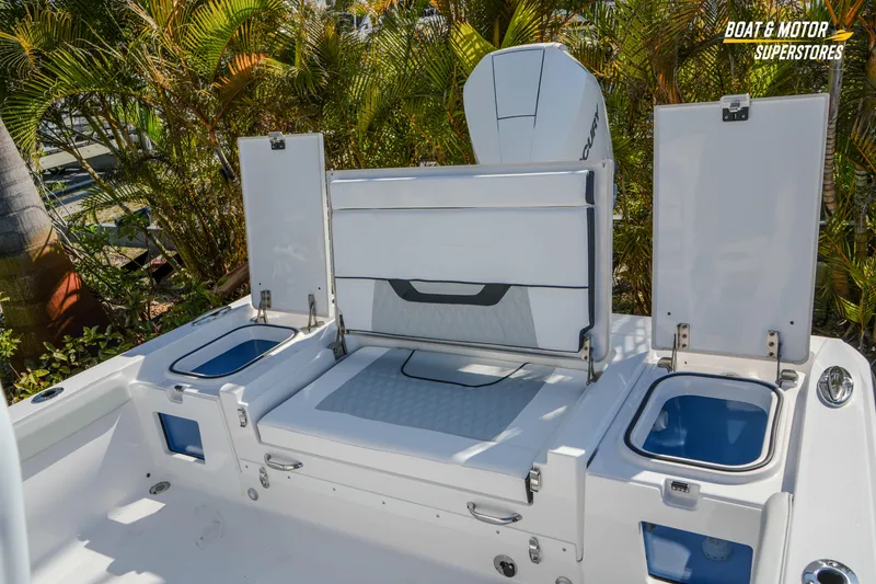 Slide: The Image of 2026 Blackfin 242 HB boat interior with open storage compartments and seating. - 24