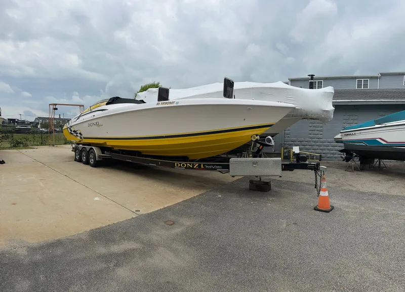 Slide: The Image of 2001 Donzi Daytona 38 ZX boat on trailer, yellow and white. - 2