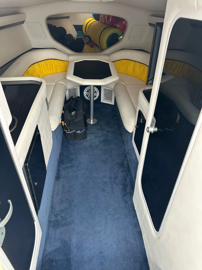 Slide: The Image of Interior of a 2001 Donzi Daytona 38 ZX with blue carpeting. - 5