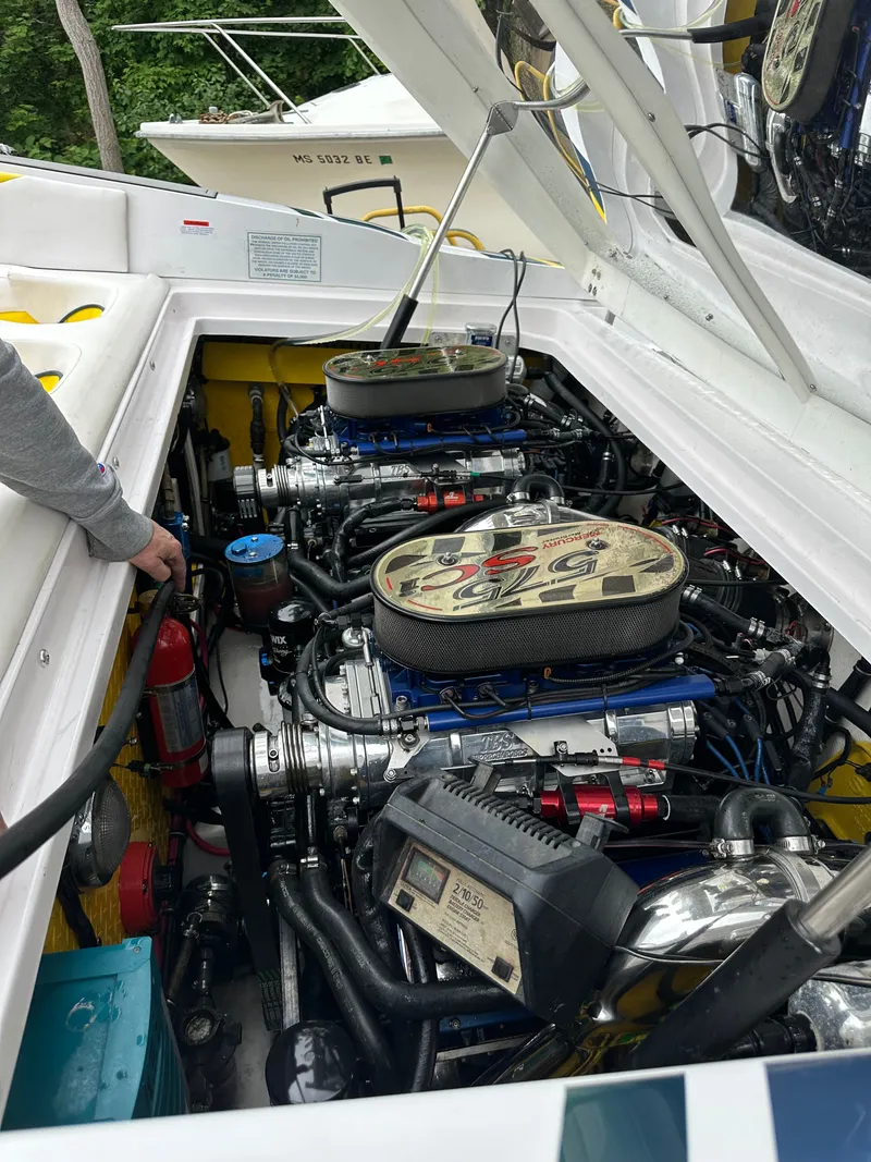 Slide: The Image of Engine compartment of a 2001 Donzi Daytona 38 ZX boat with dual engines. - 6