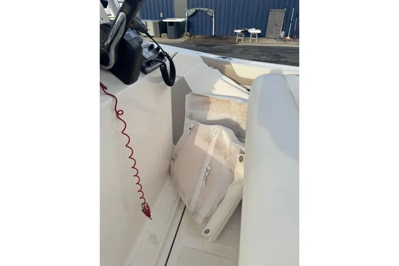 Slide: The Image of Interior of a 2013 Pioneer 197 Sportfish boat showing seating and controls. - 10