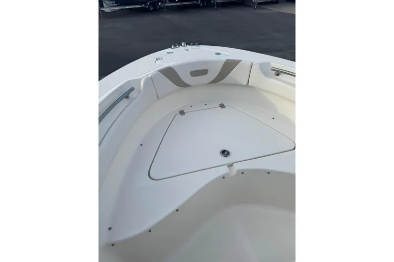 Slide: The Image of Bow area of a 2013 Pioneer 197 Sportfish boat, featuring storage compartment. - 13