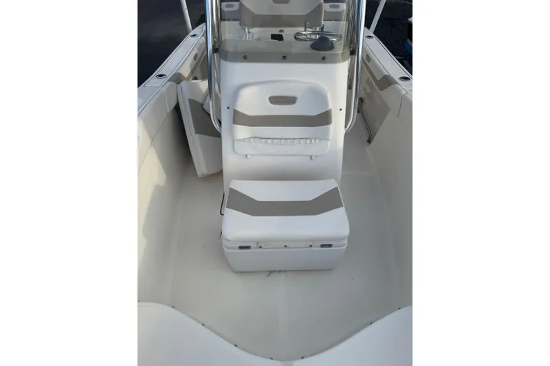 Slide: The Image of 2013 Pioneer 197 Sportfish boat interior with seating and console. - 15