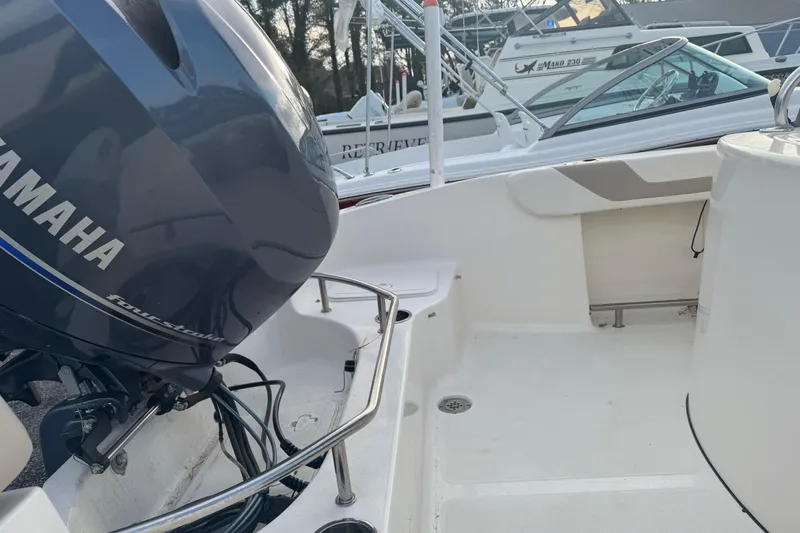 Slide: The Image of 2013 Pioneer 197 Sportfish boat with Yamaha outboard motor, featuring spacious deck area. - 4