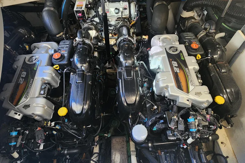 Slide: The Image of Twin engines of a 2019 Sea Ray Sundancer 350 Coupe, showcasing powerful marine engineering. - 20