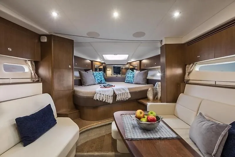 Slide: The Image of Luxurious interior of 2019 Sea Ray Sundancer 350 Coupe yacht with cozy seating and elegant decor. - 27