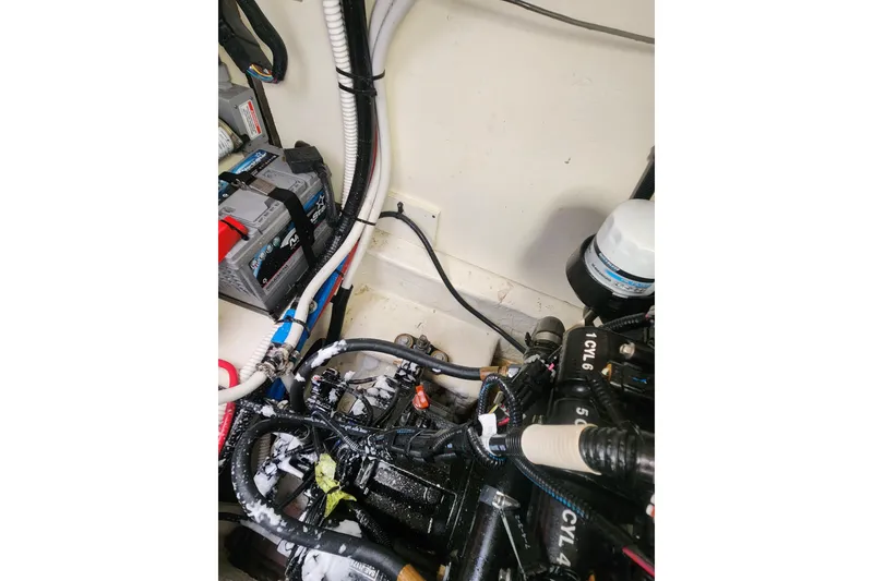 Slide: The Image of Interior of 2019 Sea Ray Sundancer 350 Coupe with TV and wooden cabinetry. - 28