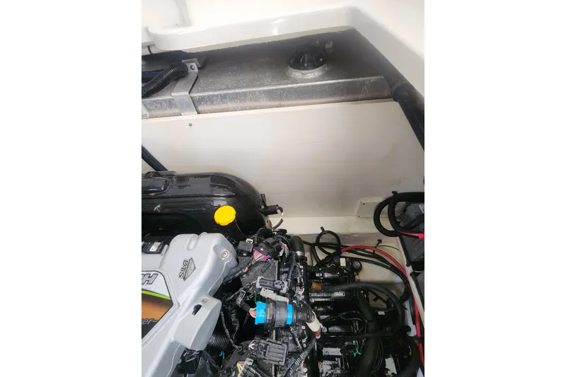 Slide: The Image of Engine compartment of 2019 Sea Ray Sundancer 350 Coupe with wiring and components visible. - 36