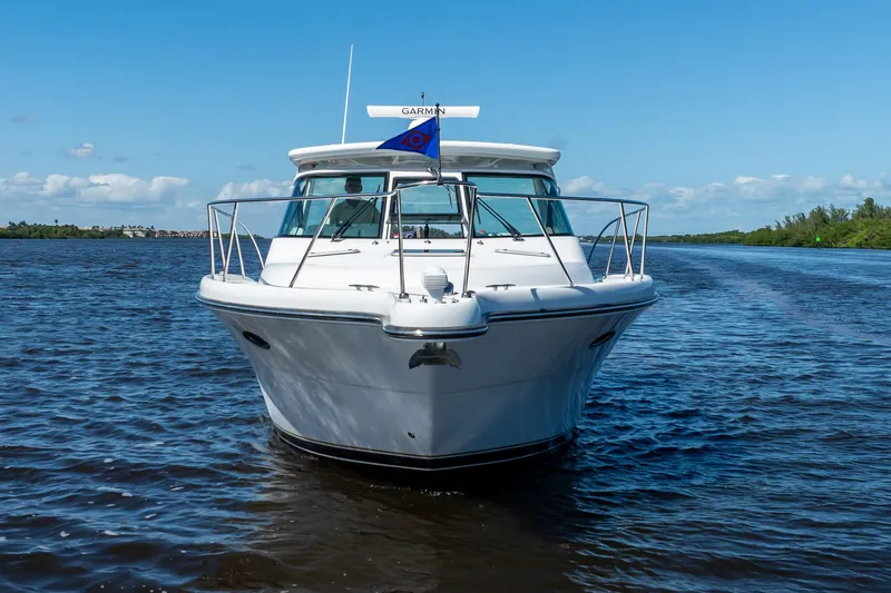 Slide: The Image of 2005 Tiara Yachts 3200 Open cruising on a sunny day, front view. - 2