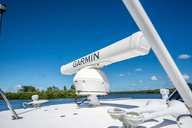 Slide: The Image of 2005 Tiara Yachts 3200 Open with Garmin radar against clear blue sky. - 27
