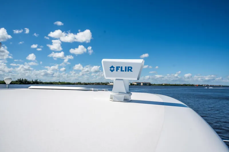 Slide: The Image of Tiara Yachts 3200 Open 2005 with FLIR system on deck, blue sky background. - 28