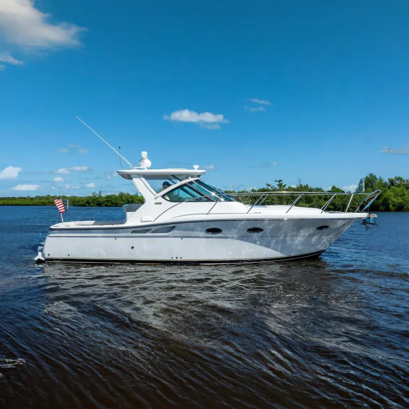 Slide: The Image of 2005 Tiara Yachts 3200 Open cruising on a sunny day, side view. - 3