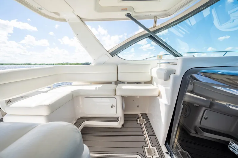 Slide: The Image of Luxurious interior of 2005 Tiara Yachts 3200 Open with white seating and sleek design. - 30