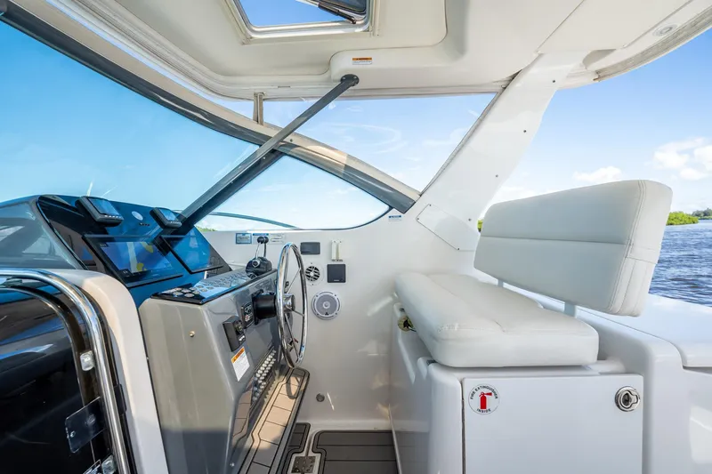 Slide: The Image of 2005 Tiara Yachts 3200 Open helm with modern controls and comfortable seating. - 33