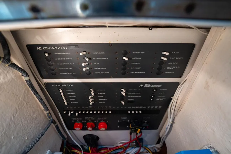 Slide: The Image of Electrical panel of a 2005 Tiara Yachts 3200 Open, showing AC and DC distribution. - 37