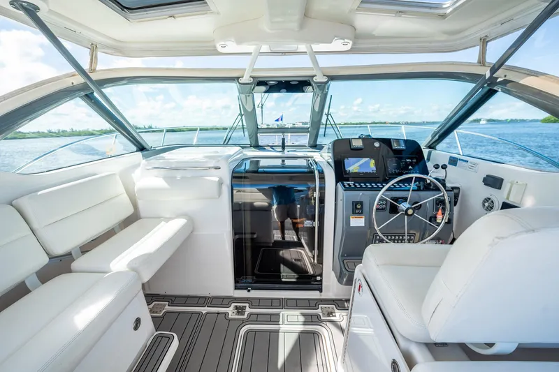Slide: The Image of 2005 Tiara Yachts 3200 Open cockpit with modern controls and comfortable seating. - 39