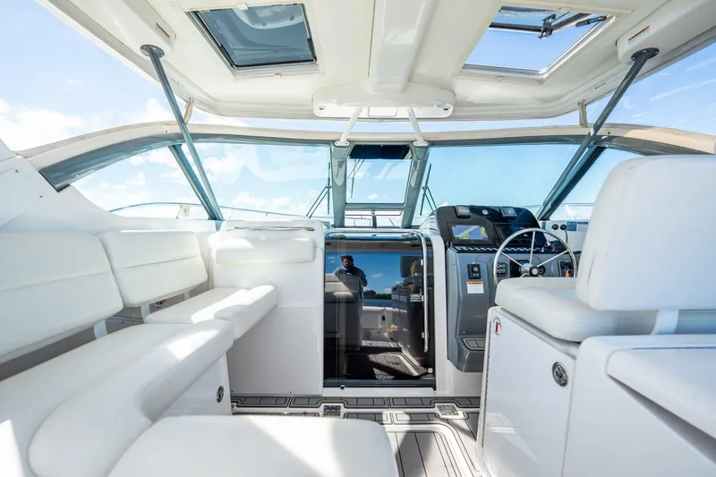 Slide: The Image of 2005 Tiara Yachts 3200 Open interior with white seating and modern helm. - 40