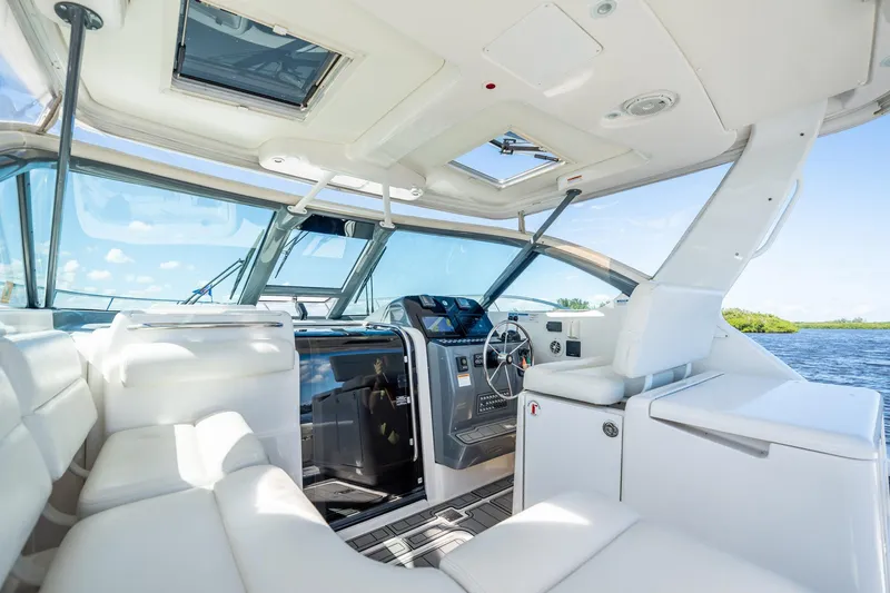 Slide: The Image of Interior of 2005 Tiara Yachts 3200 Open, featuring luxurious seating and modern helm. - 41