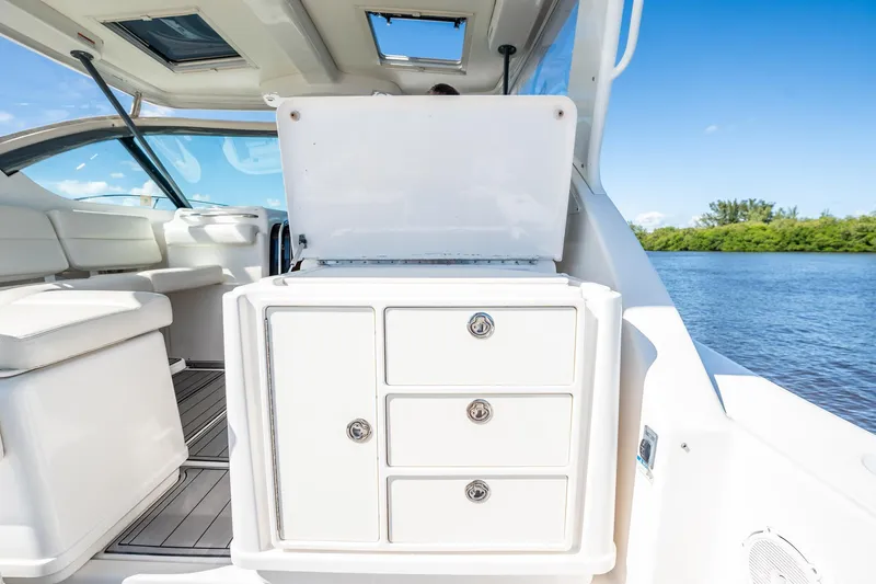 Slide: The Image of 2005 Tiara Yachts 3200 Open interior with storage drawers, open water view. - 46