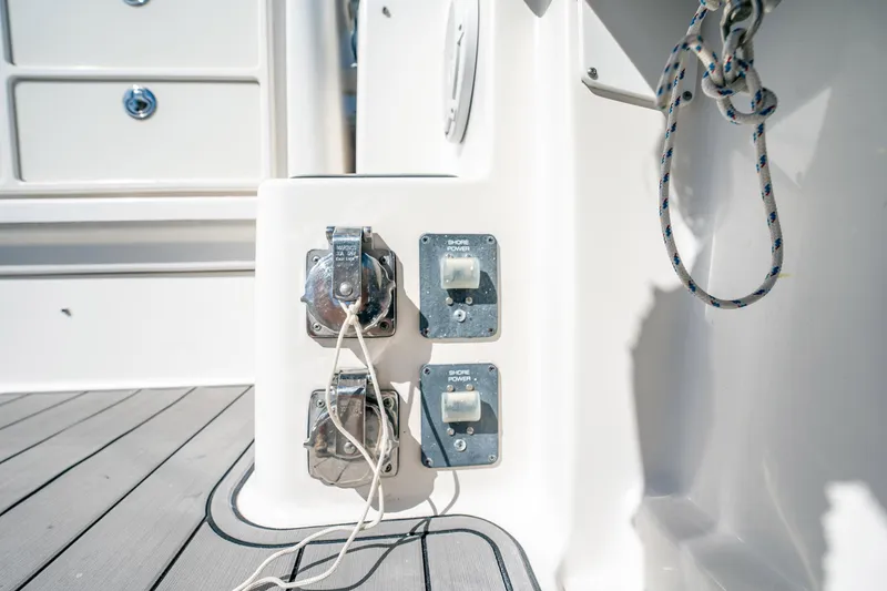Slide: The Image of 2005 Tiara Yachts 3200 Open shore power connections on deck with rope detail. - 48