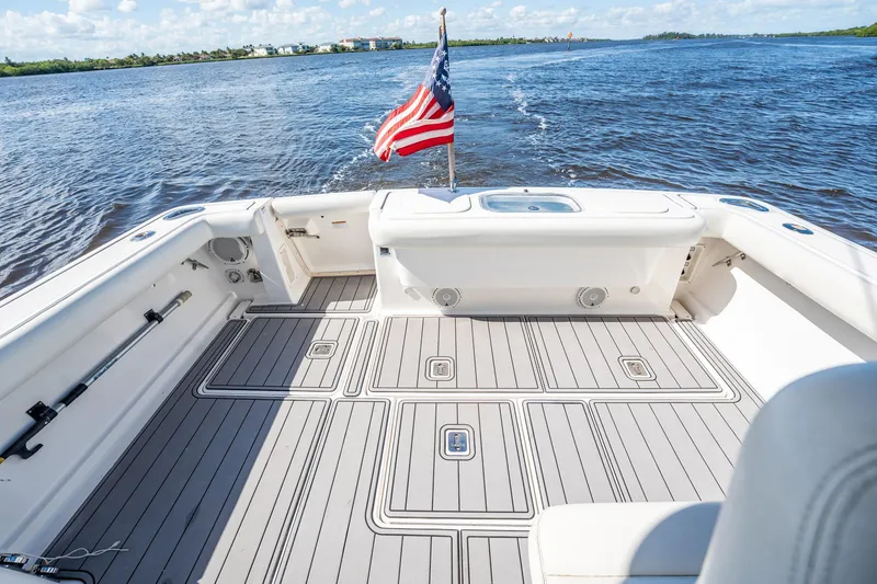 Slide: The Image of 2005 Tiara Yachts 3200 Open boat deck with American flag on open water. - 54