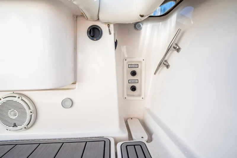 Slide: The Image of 2005 Tiara Yachts 3200 Open interior with water controls and speaker. - 56