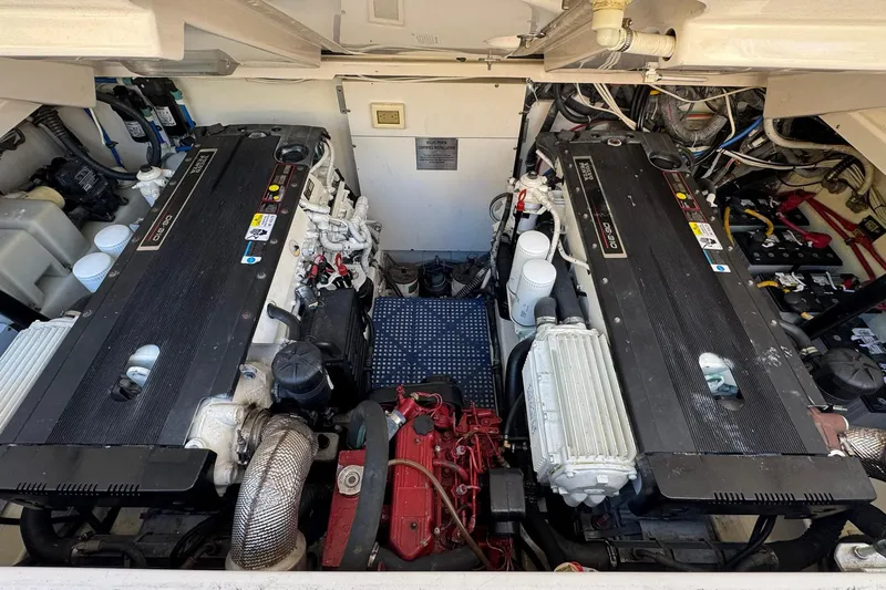 Slide: The Image of Engine room of a 2005 Tiara Yachts 3200 Open, featuring dual diesel engines. - 64