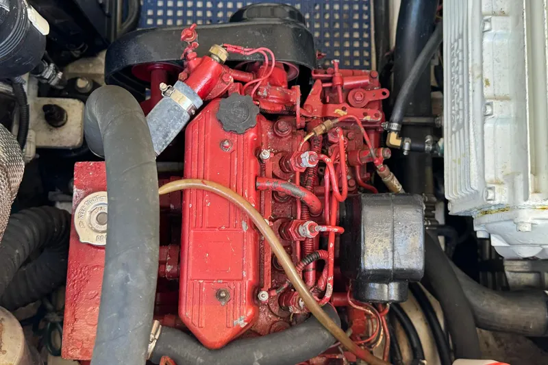 Slide: The Image of Engine compartment of a 2005 Tiara Yachts 3200 Open, featuring a red engine block. - 66