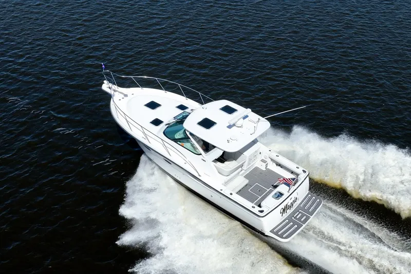 Slide: The Image of 2005 Tiara Yachts 3200 Open cruising on water, aerial view. - 70