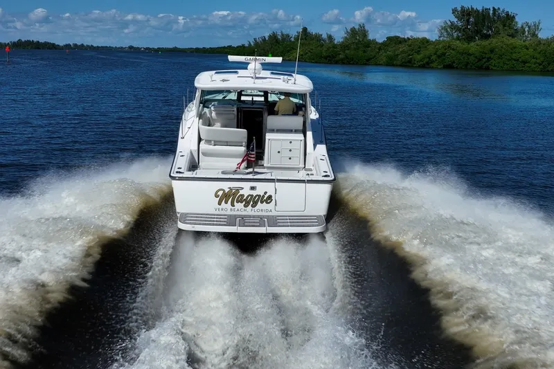 Slide: The Image of 2005 Tiara Yachts 3200 Open cruising on a scenic waterway, rear view. - 71
