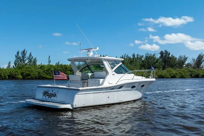 Slide: The Image of 2005 Tiara Yachts 3200 Open cruising on a sunny day with clear blue skies. - 73