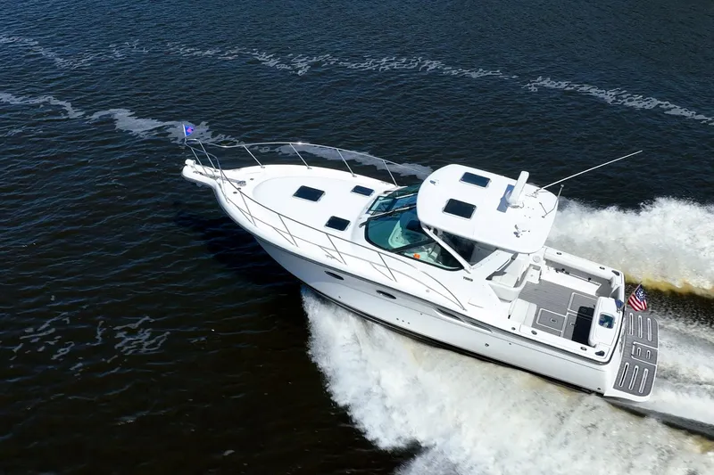Slide: The Image of 2005 Tiara Yachts 3200 Open cruising on water, aerial view. - 77