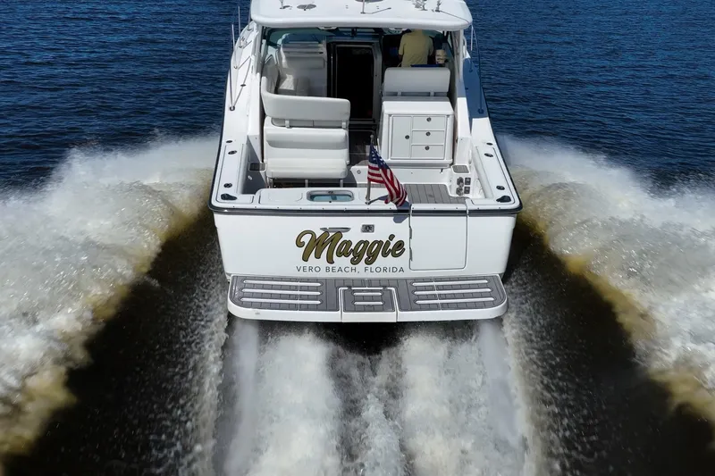 Slide: The Image of 2005 Tiara Yachts 3200 Open cruising on water, rear view, Vero Beach, Florida. - 79