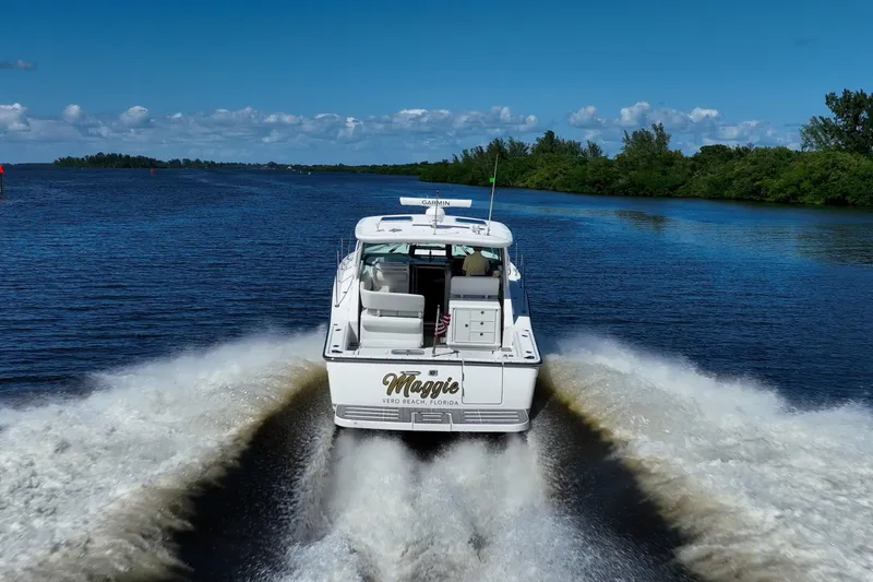 Slide: The Image of 2005 Tiara Yachts 3200 Open cruising on a scenic waterway. - 80