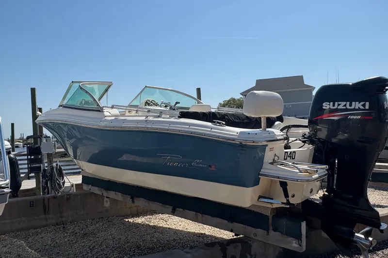 Slide: The Image of 2012 Pioneer 197 Venture boat with Suzuki outboard motor on a lift. - 10