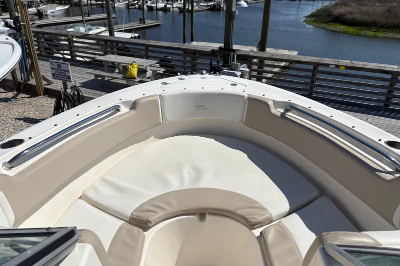 Slide: The Image of Bow seating area of a 2012 Pioneer 197 Venture boat at a marina. - 12