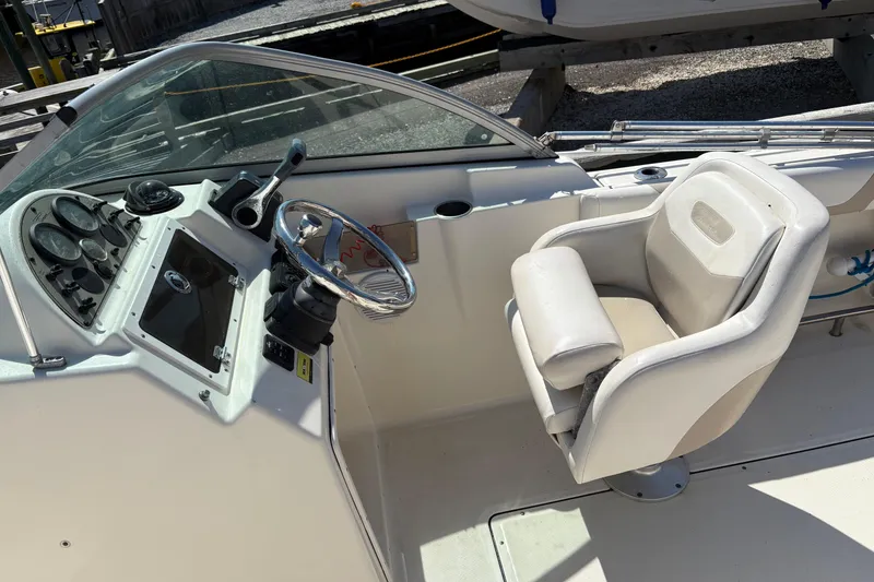 Slide: The Image of Interior of a 2012 Pioneer 197 Venture boat showing steering wheel and captain's chair. - 15