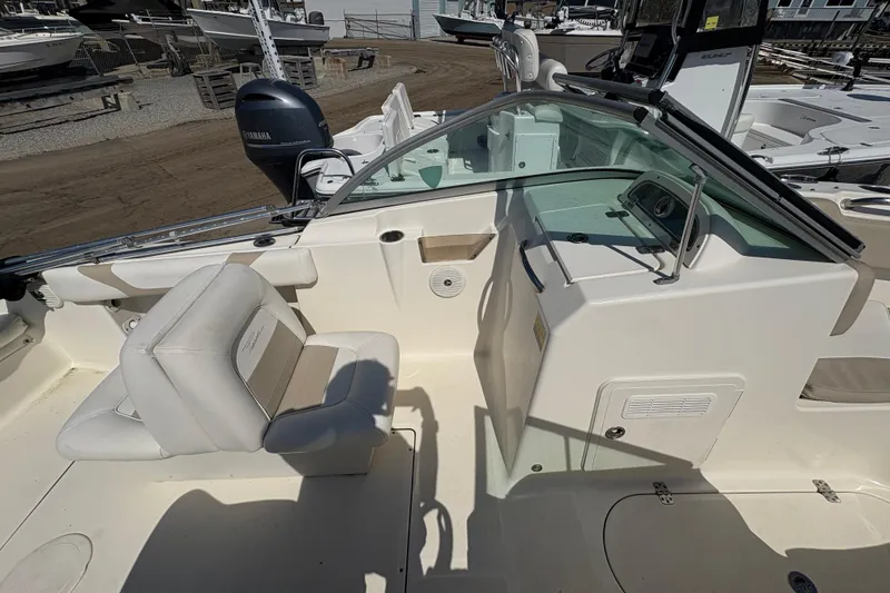 Slide: The Image of Interior of a 2012 Pioneer 197 Venture boat with seating and control panel. - 16