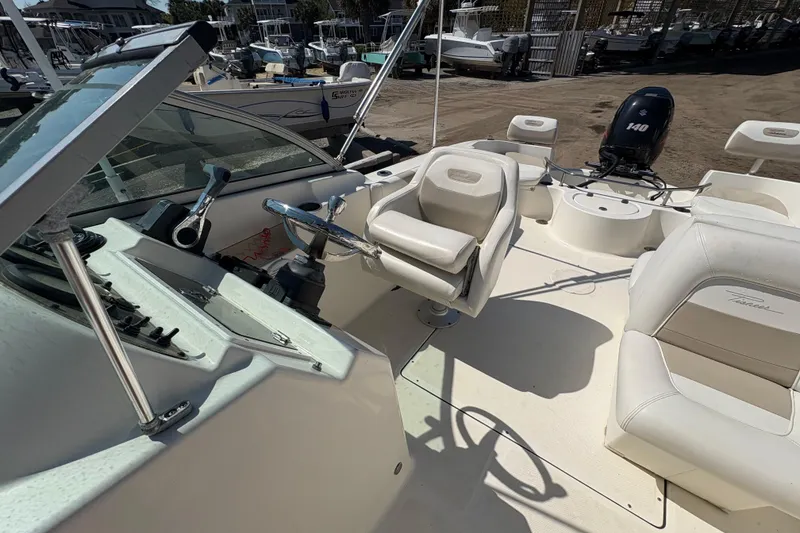 Slide: The Image of 2012 Pioneer 197 Venture boat interior with steering wheel and seating. - 19