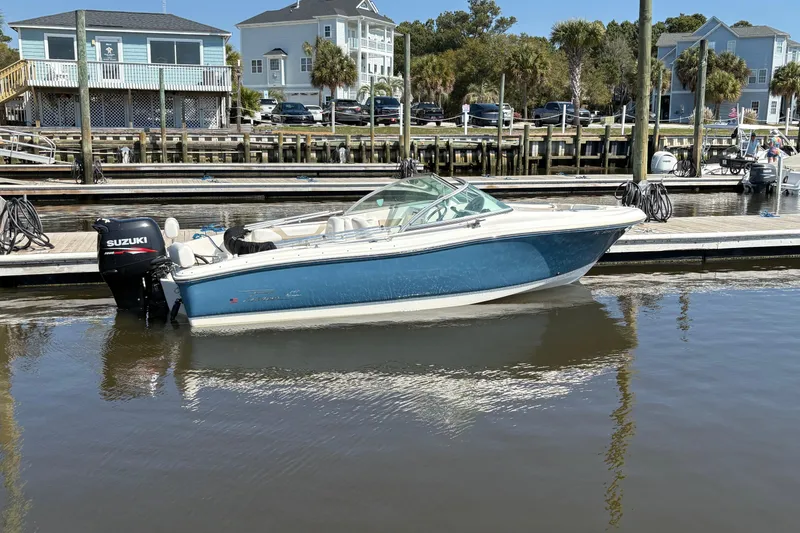 Slide: The Image of 2012 Pioneer 197 Venture boat docked with Suzuki engine. - 2