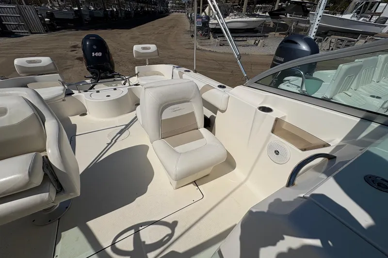 Slide: The Image of 2012 Pioneer 197 Venture boat interior with seating and Yamaha outboard motor. - 20